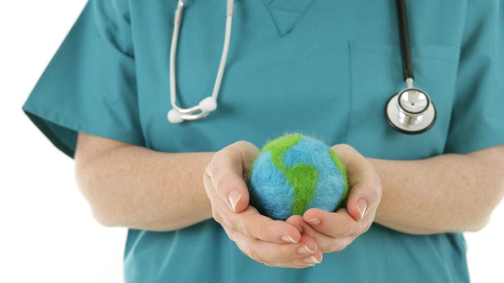 A nurse holding a globe carefully. Personifying keeping the world safe through travel health 