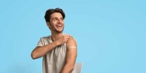 Annual Immunisation update product image showing man with plaster after being vaccinated