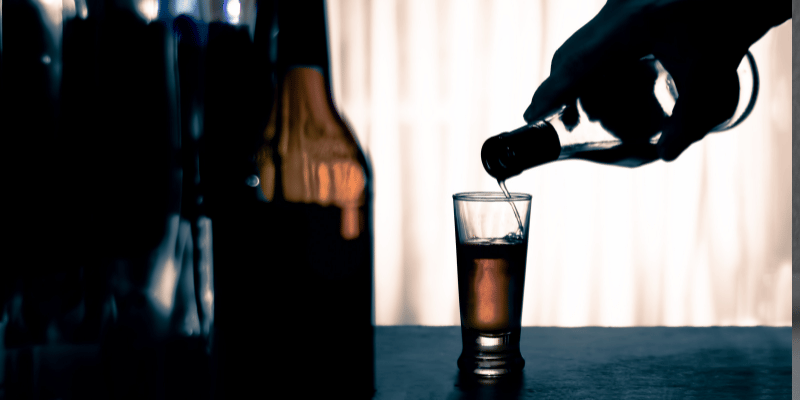Image showing person pouring an alcoholic drink.
Increased drug and alcohol intake