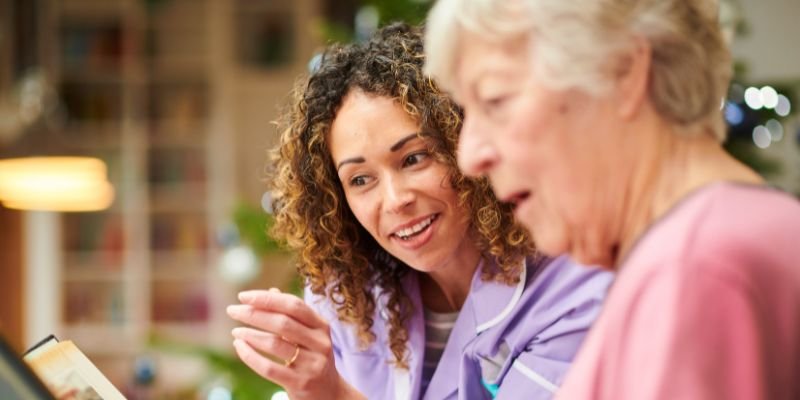 Image of a healthcare professional engaging with an elderly woman, demonstrating an element of the Assessment of Older People course