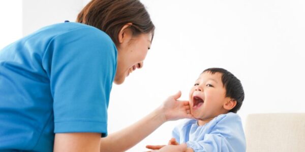 Image showing a young boy being cared for by a healthcare professional.