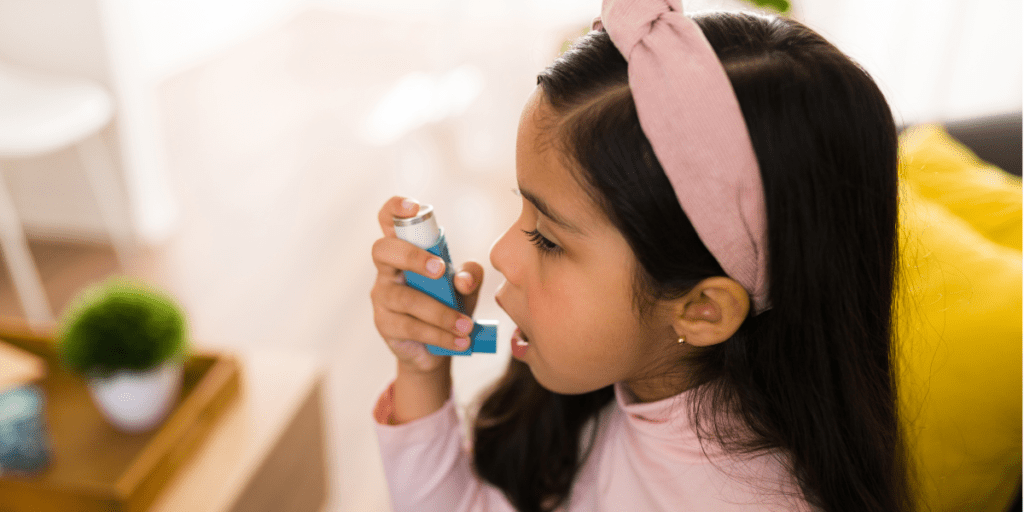 A child treats their asthma with an inhaler