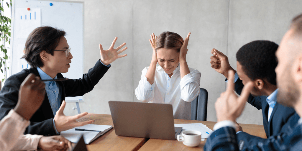 Work colleagues being abusive to a member of the team showing bullying and harassment in the workplace.