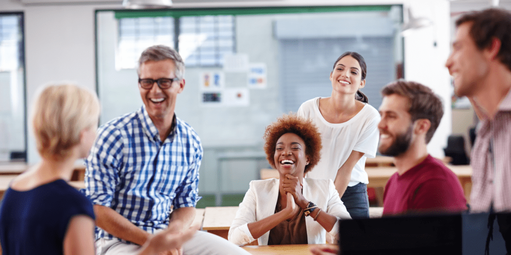 Work colleagues getting along at work showing how bullying and harassment training can benefit employees.