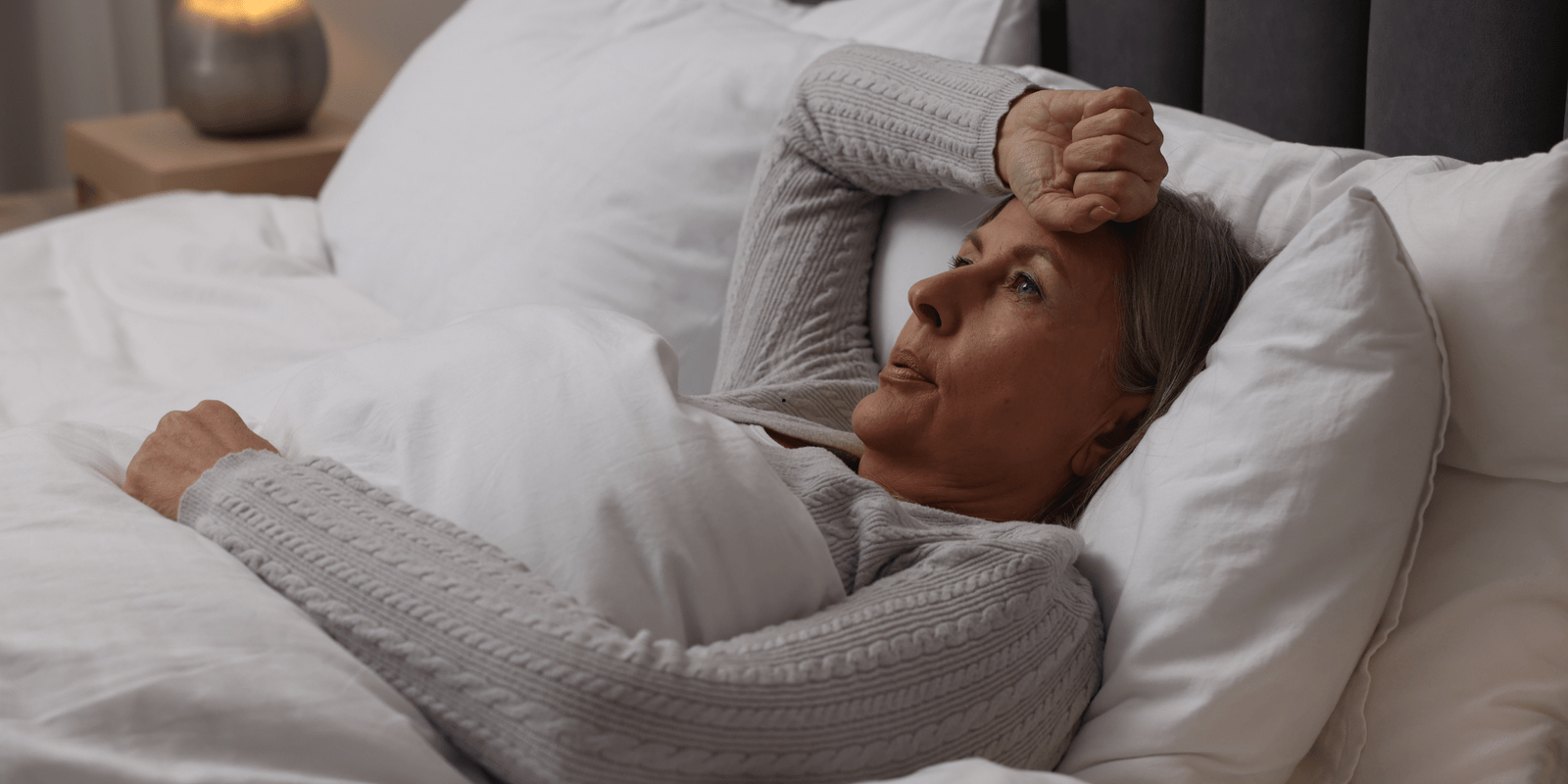 Managing menopause symptoms – woman resting in bed