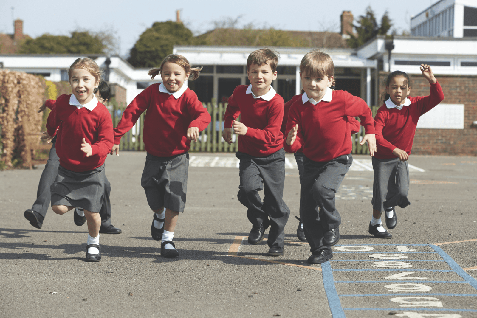 School children running in a school playground