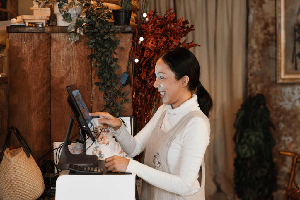 A female cashier serves a customer