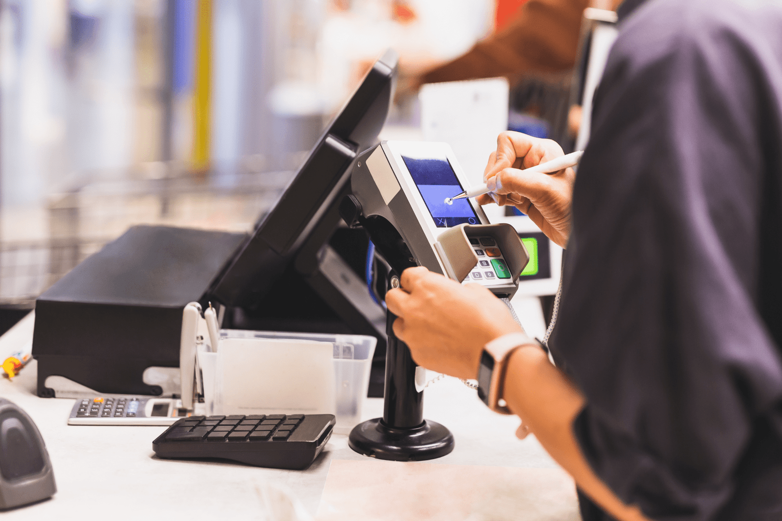 A cashier serving a customer