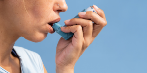 Image showing woman with asthma inhaler Asthma Update in Primary Care