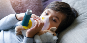 Image showing a paediatric patient receiving their inhaler via a spacer. Asthma training