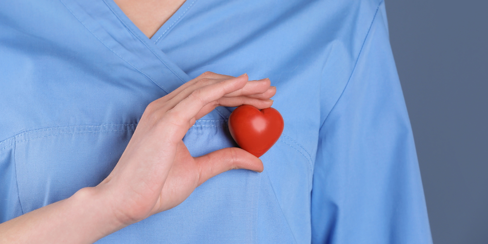 Image showing a nurse holding up a heart symbol
Heart Month
