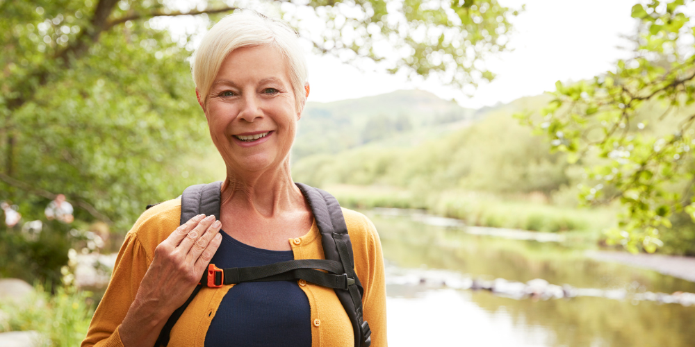 Image showing a woman stood beside a river bank.
Rivers and Health